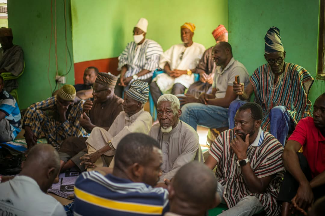 Nigerians of different faiths and ethnicities in conversation at a community dialogue